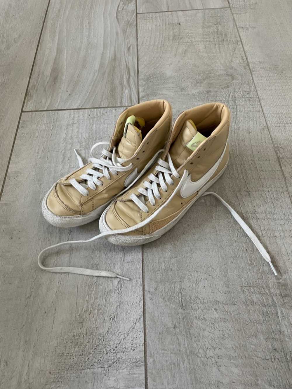 Nike Beige High-Top Sneakers with White Swoosh